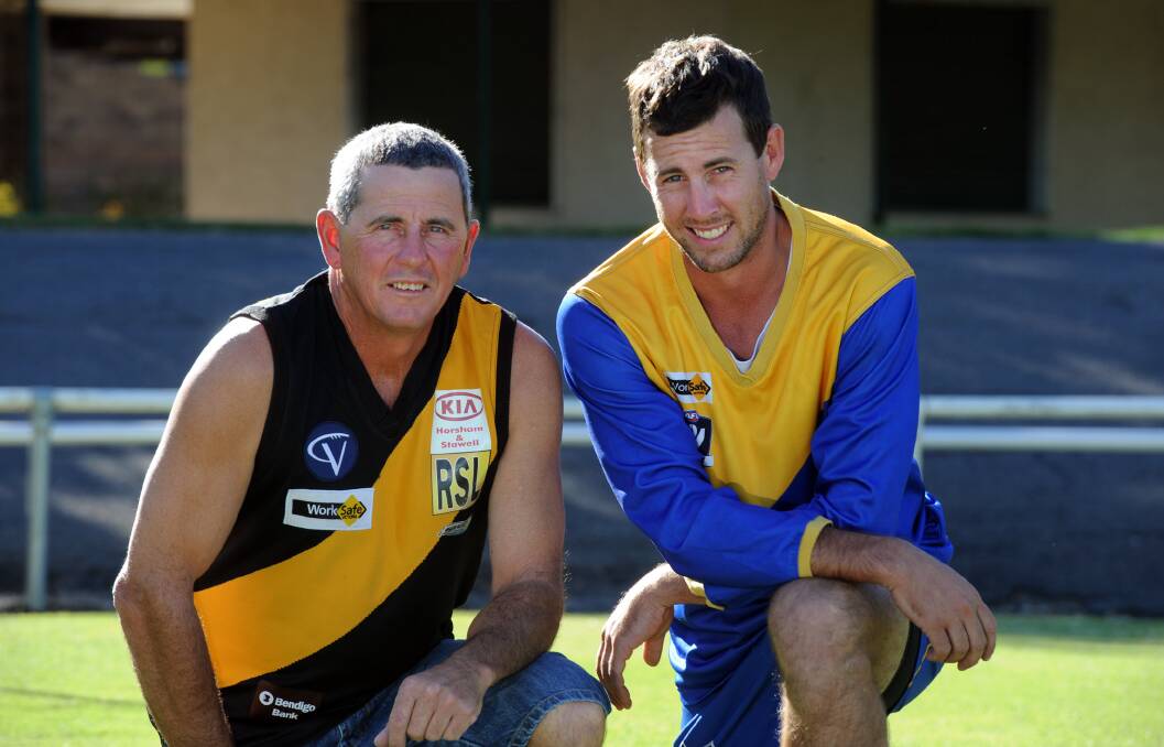 LIKE FATHER, LIKE SON: Chris and Tim Friend show their team spirit. Pictures: PAUL CARRACHER