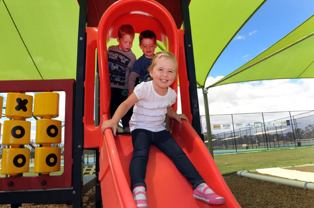 FUN AND GAMES: Haven Community Playgroup leaders have invited Wimmera children to join in the fun on Tuesday mornings. Jayda Mills, 3, enjoys the slide at the playgroup’s new playground, while twins Jack and Harry Toet, 3, wait their turn. Pictures: PAUL CARRACHER