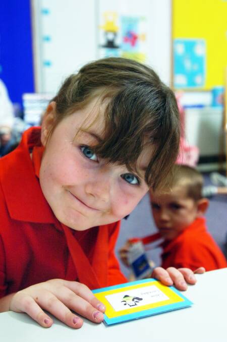 2007: New prep Chloe Loveday, 4, finds a desk to stick her name on at Horsham 298 Primary School.
