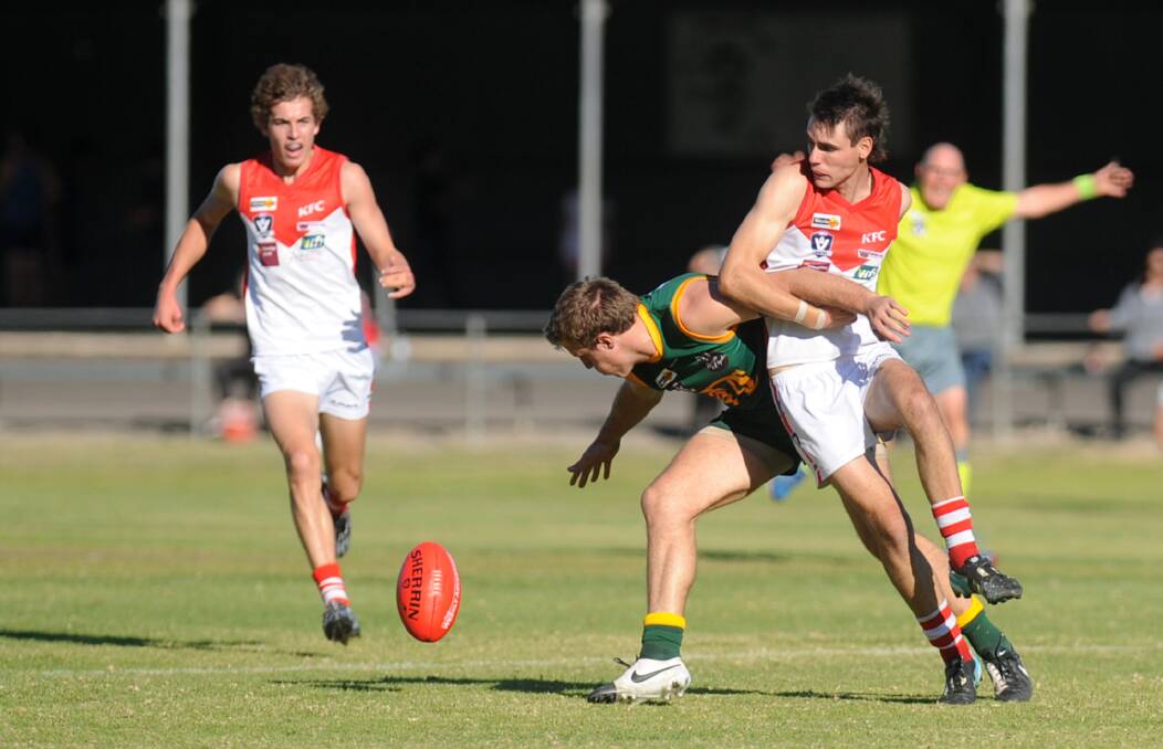 Dimboola's Torin Petrie and Ararat's Brady Miller clash during Saturday's match. Miller has been suspended after making forceful, front-on contact to Petrie. Picture: SAMANTHA CAMARRI