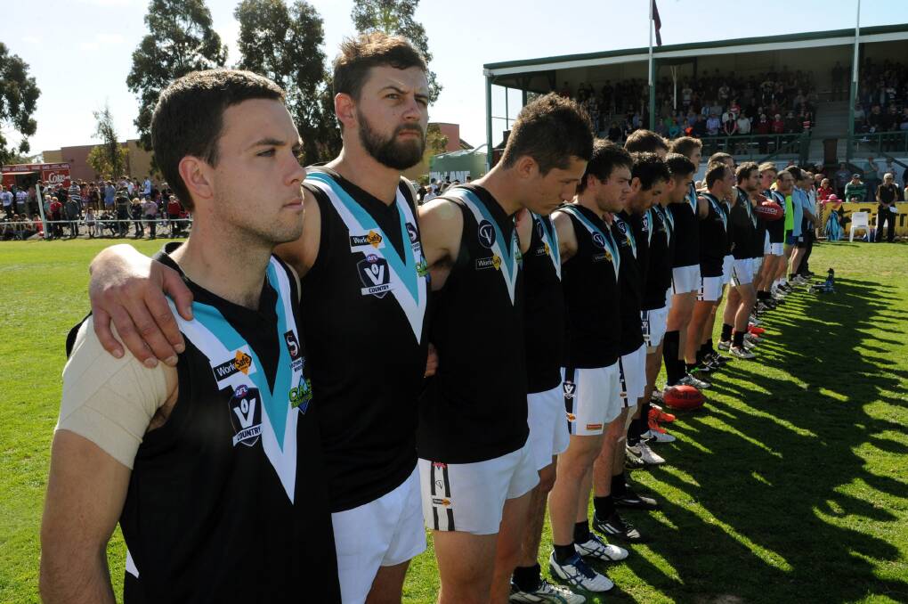 Swifts Scott Carey and Ben Martin line up with their team-mates ahead of the 2014 grand final against Laharum. Picture: PAUL CARRACHER