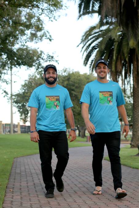 HAPPY WALKERS: Melbourne to Mallee motor neurone disease fundraisers Matt Sofoulis and Tim Solly in action at Horsham's May Park on Tuesday. Pictures: THEA PETRASS