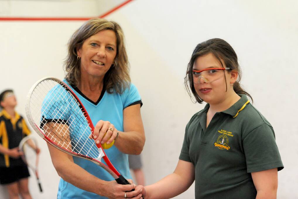 LEARNING TO PLAY: Horsham Squash Club development officer Launa Schilling works with Estelle Pritchard during a junior squash day in October. Ms Schilling wants young women to get involved in the sport. Picture: SAMANTHA CAMARRI