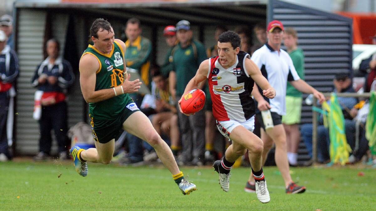 Conor O'Beirne tries to evade Nigel Sibson in last year's Wimmera Football League grand final at Davis Park, Nhill. Picture: PAUL CARRCHER