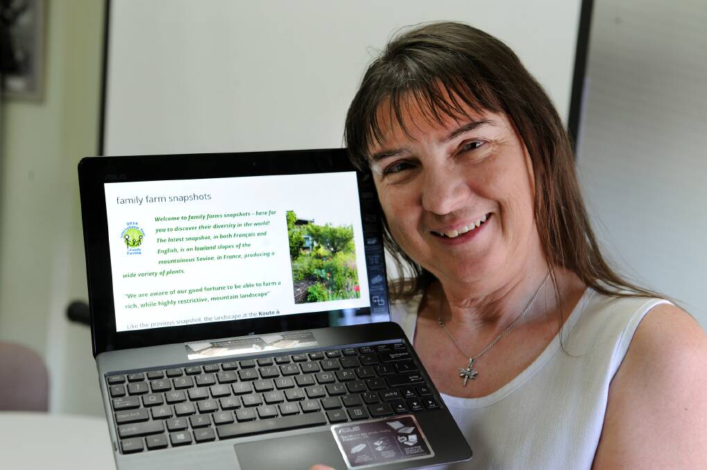 FARMING FAMILIES: Warracknabeal’s Jeanie Clark shows her farming families website she created as part of the International Year of Family Farming. Picture: PAUL CARRACHER