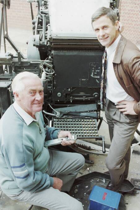 CENTURY: Mail-Times foundation editor Allan Lockwood with his son Keith, pictured in 1999 when the family celebrated 100 years of journalism in the Wimmera. They are beside a Linotype machine, used to cast type from molten metal. Picture: DAVID FLETCHER