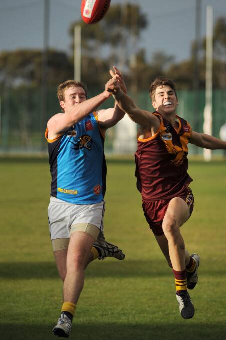 STRONG PERFORMER: Warrack Eagles’ Dale Hinkley, right, was among his side’s best players in its last match against Nhill a fortnight ago. Hinkley and the Eagles will hope to continue their form against Dimboola on Saturday. Picture: PAUL CARRACHER