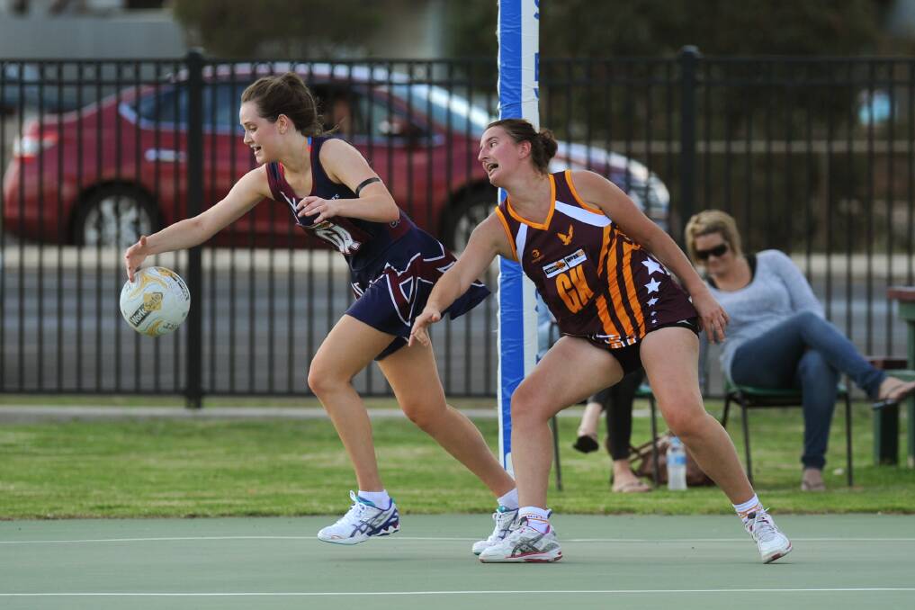 NETBALL’S BACK: Horsham goal attack Georgia Duncan gets goal-side of Warrack Eagles goal keeper Claire Schultz in their Wimmera Netball Association A Grade season opener on Saturday. Both were named among their sides’ best players, with the Demons prevailing 61-21. Pictures: PAUL CARRACHER