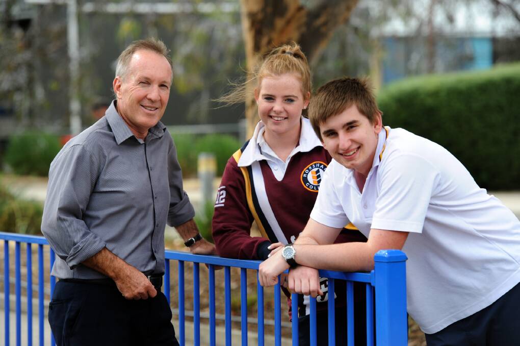 NAVIGATING THE SYSTEM: Horsham College pathways leading teacher Chris Wallis chats to year 12 student Jessie Wood and year 11 student Karl Reiter about managing the transfer to university after secondary school. Picture: PAUL CARRACHER