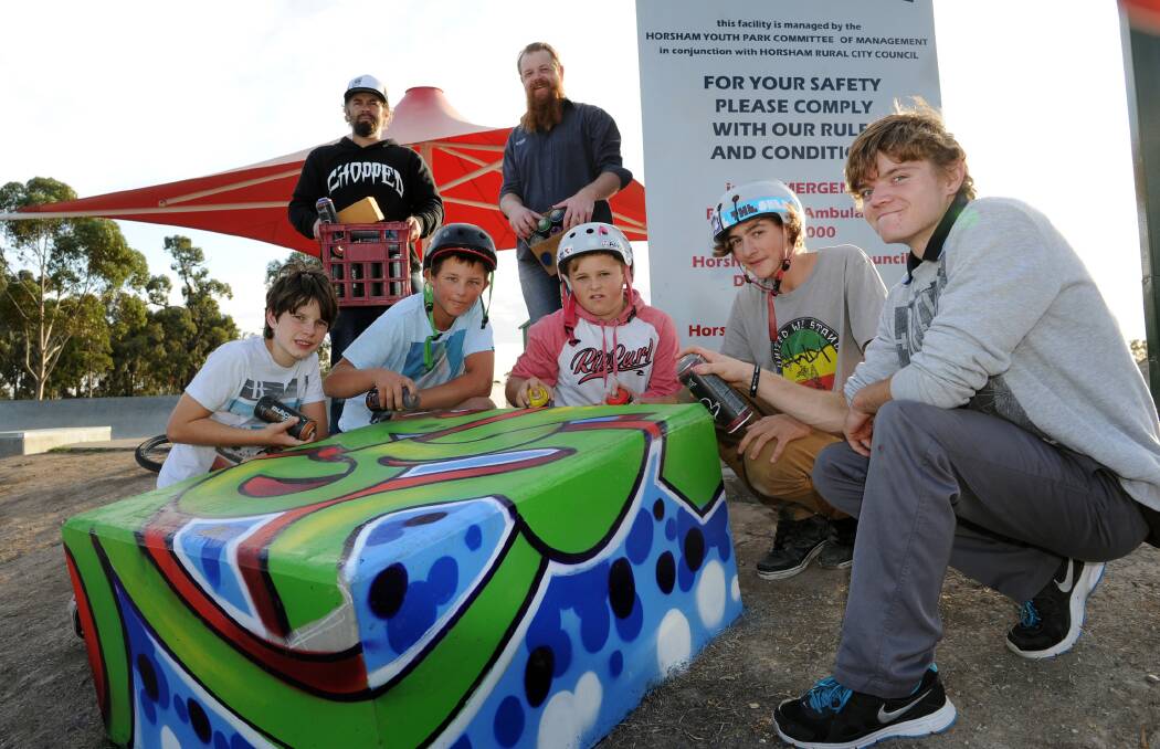 ARTISTIC: Karl Stehn and Robbie Miller help, from left, Caleb Bolwell, Tyson Harris, Dylan Bates, Ben Hallam and Josh Mackley paint designs at Horsham Skate Park. Picture: PAUL CARRACHER
