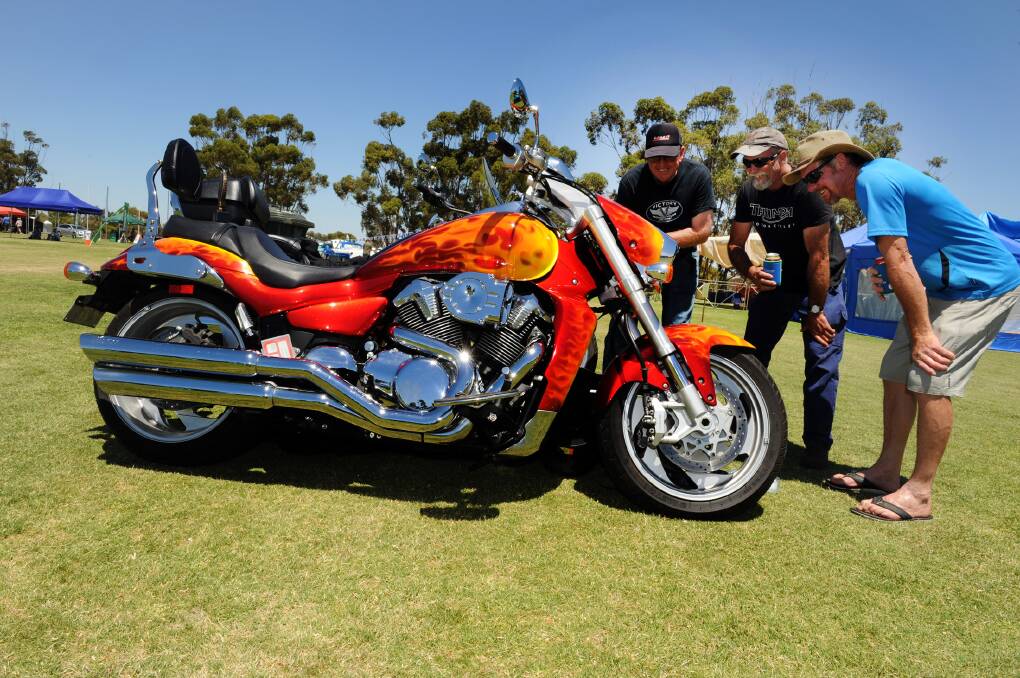 Ron Ayars, Phil Dixon and Andrew Witmitz admire a motorbike at the Kaniva Car and Bike Show.