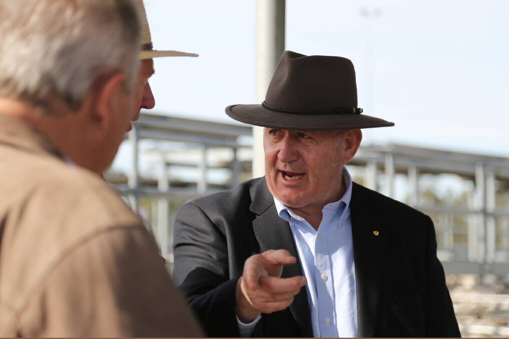 Governor-General Peter Cosgrove speaks to farmers at the Horsham Regional Livestock Exchange. Picture: THEA PETRASS