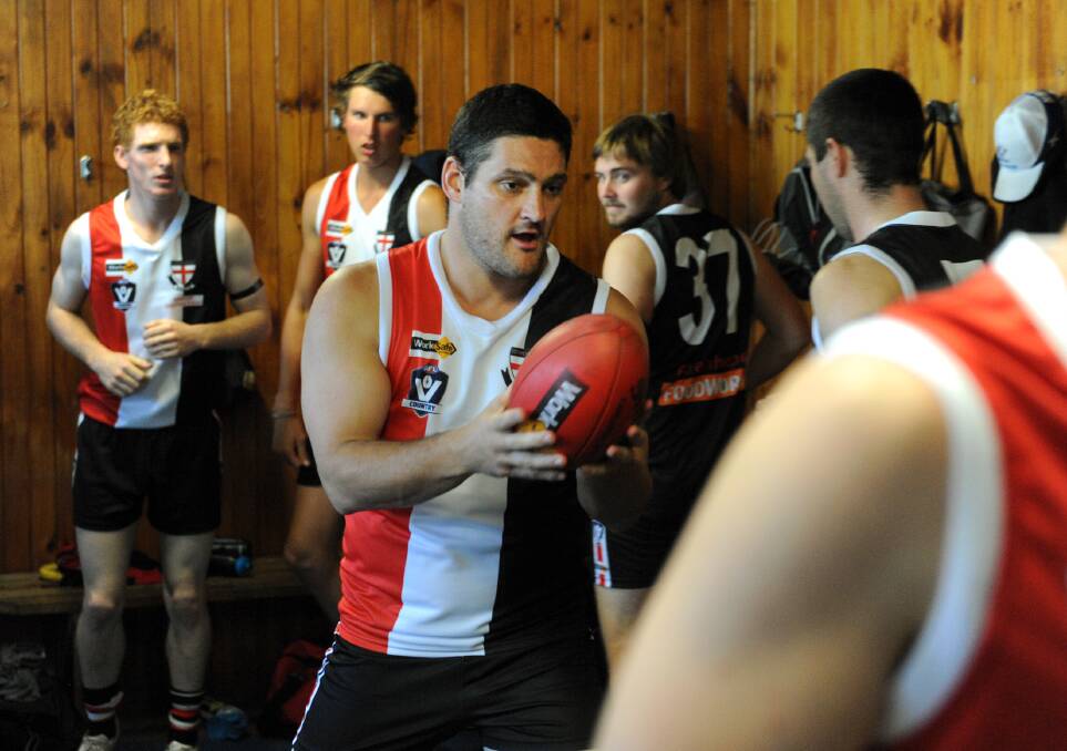 Brendan Fevola warms up with the Edenhope-Apsley team.