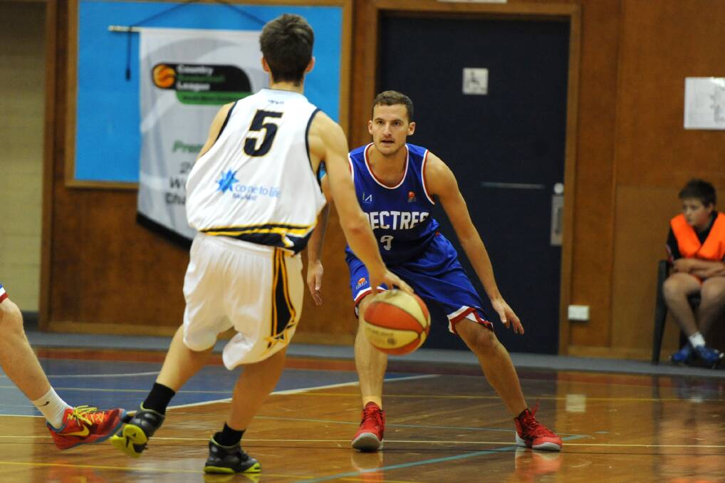 FACE OFF: Ballarat Miners' Brady Neill and Nunawading Spectres' Hayden Czwarno go head-to-head at the weekend.