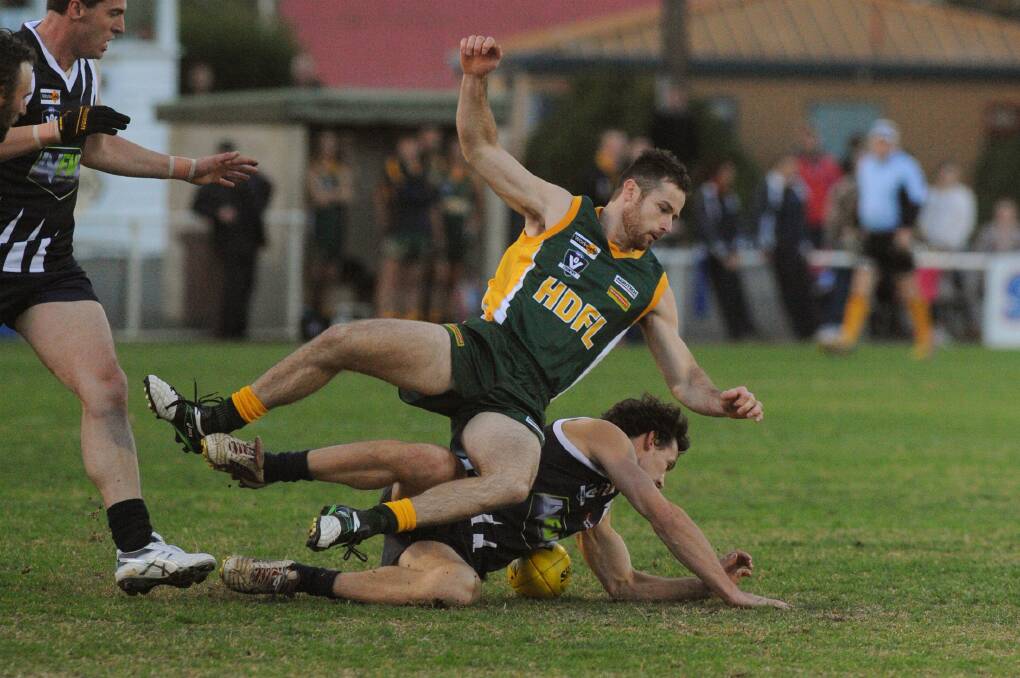 ACTION: Horsham District Football League's Jarred Combe in action during interleague last year. The league and Horsham District Netball Association will merge to create the Horsham District Football Netball League. Picture: PAUL CARRACHER