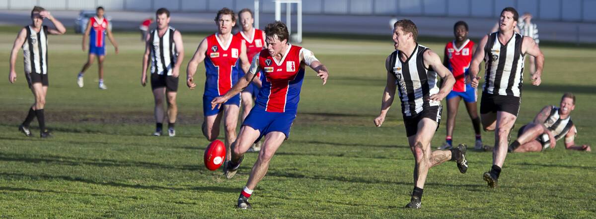 ON THE MOVE: St Arnaud’s Jake Patching bursts away from a pack of players in the Saints’ win over Boort on Saturday. Picture: JASON SMITH