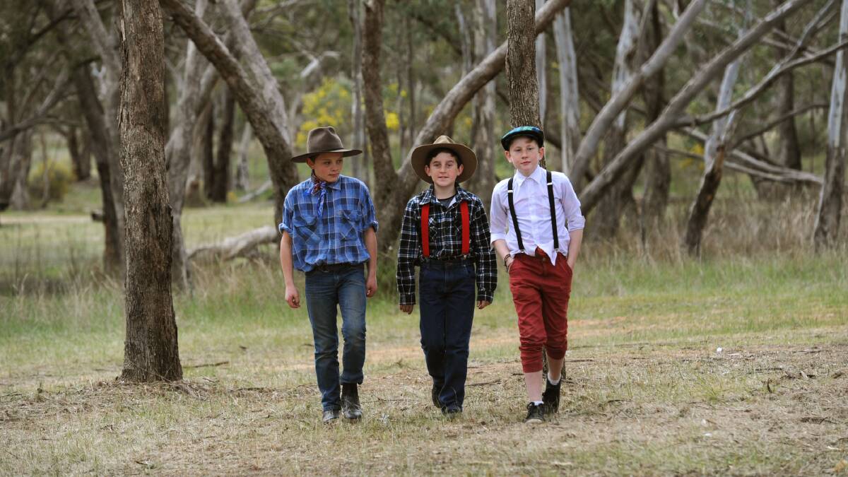 BUSH WALK: Edenhope College students Jackson Palmer, Kane Williams and Brock Summerhayes walk through the West Wimmera scrub in 1850s costumes during Lost in the Bush Found Day at Jane Duff Memorial Park at Mitre on Wednesday. Picture: PAUL CARRACHER