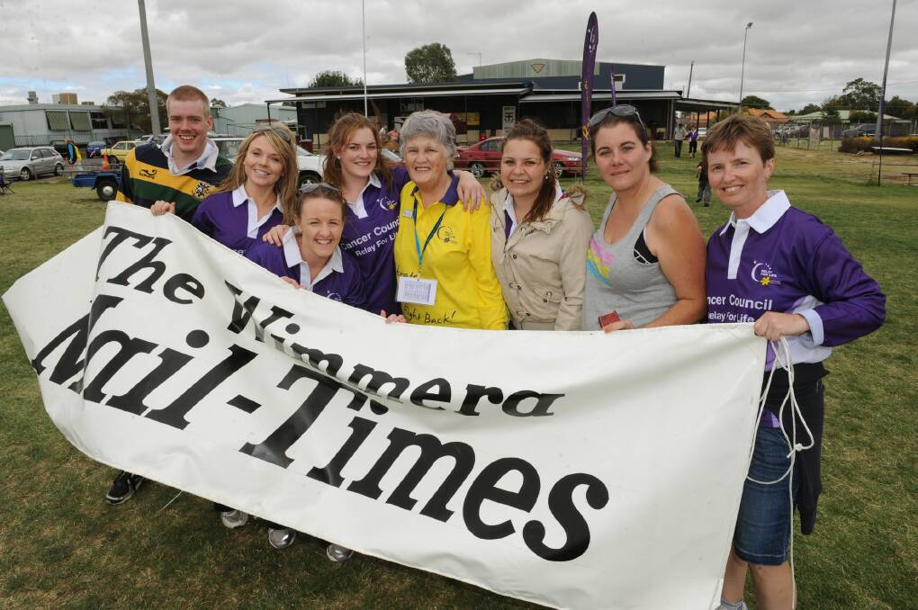 The Mail-Times Relay For Life team in action, from left, Colin MacGillivray, Sarah Scully, Carly Werner, Cass Dalgleish, Ashlee Healey, April Rabl and Kelly Laird, with Rene Vivian, centre. Picture: PAUL CARRACHER