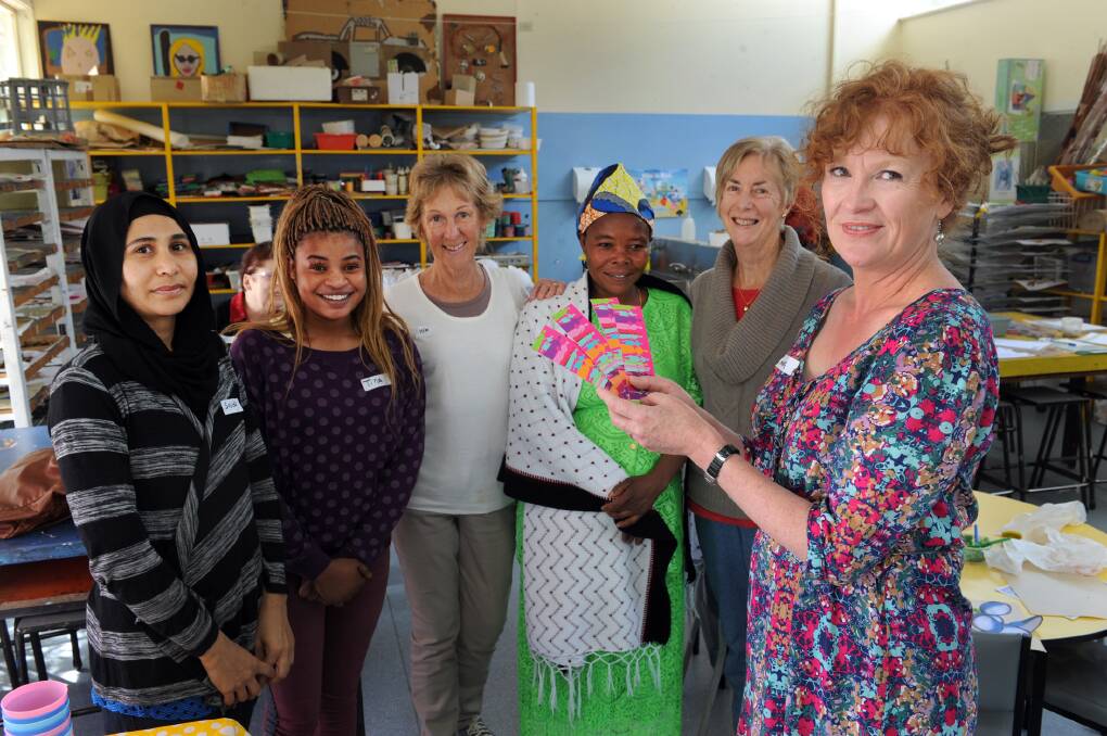 VITAL INFORMATION: BreastScreen Victoria health promotion officer Marg Lannen, right, leads a breast awareness information session for migrant women on Wednesday. Pictured from left are Sajida Maqbool, Tina Kalenzo, Colleen Sturrock, Venatia Mukinitae and Sandra McNee. Picture: PAUL CARRACHER
