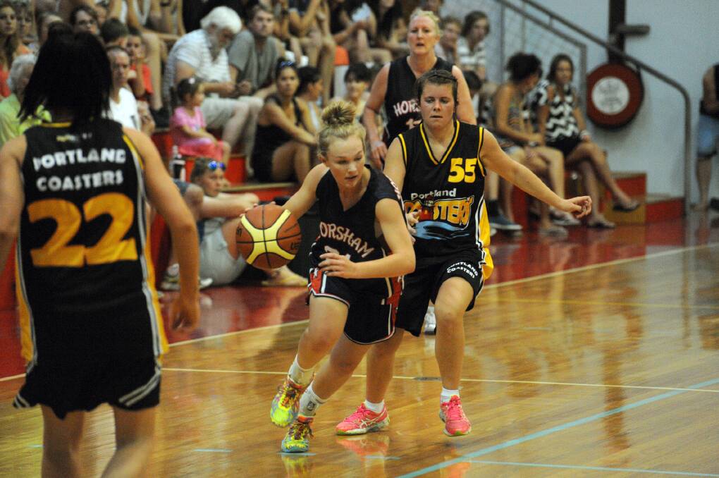 ON THE MOVE: Horsham Hornet Aily McAuliffe stays in front of her player during the Hornets v Portland grand final.