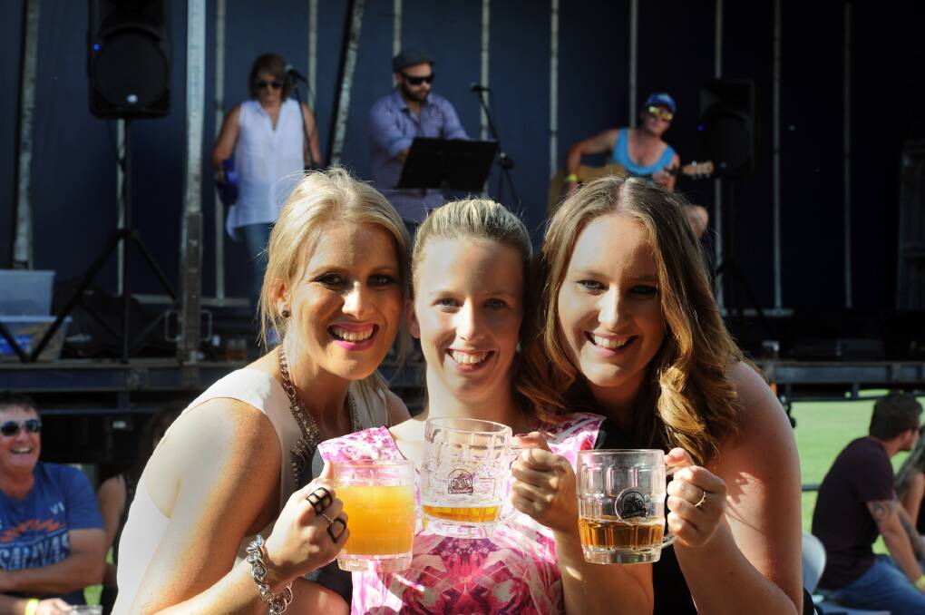 PARTY TIME: Pimpinfest organisers Leah Dumesny, Kelly Kirkpatrick and Kelsey Hamilton enjoy a drink at the festival on Saturday. Pictures: PAUL CARRACHER