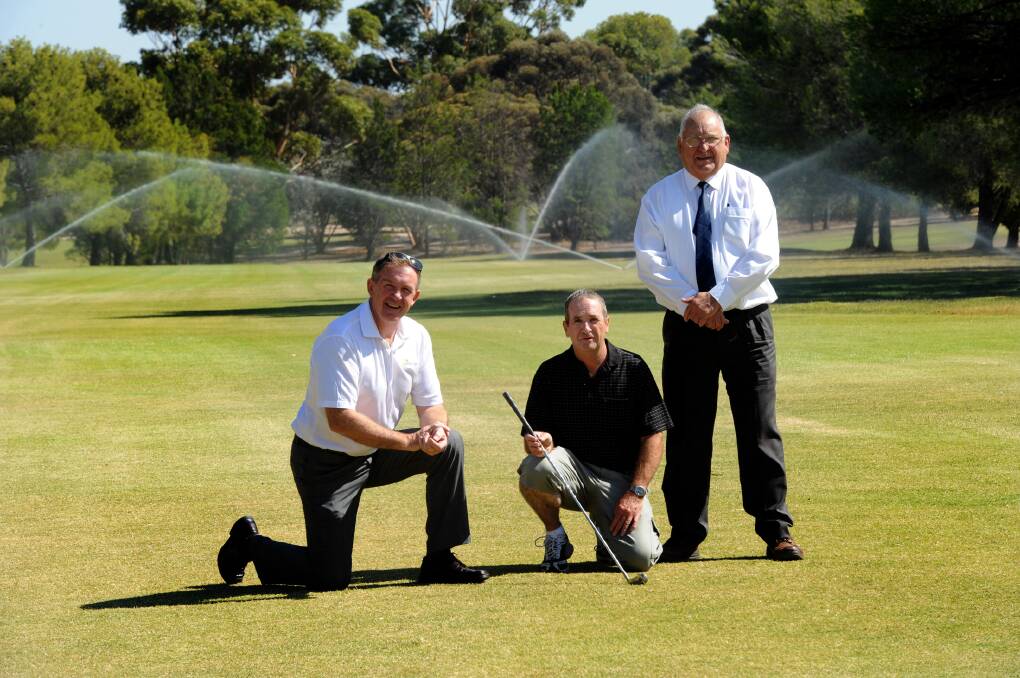 ALL SEASONS: Minister for Sport and Recreation Hugh Delahunty, Nhill Golf Club president Les Newton and Hindmarsh Shire Council mayor Rob Gersch inspect Nhill Golf Club’s new watering system. Picture: PAUL CARRACHER