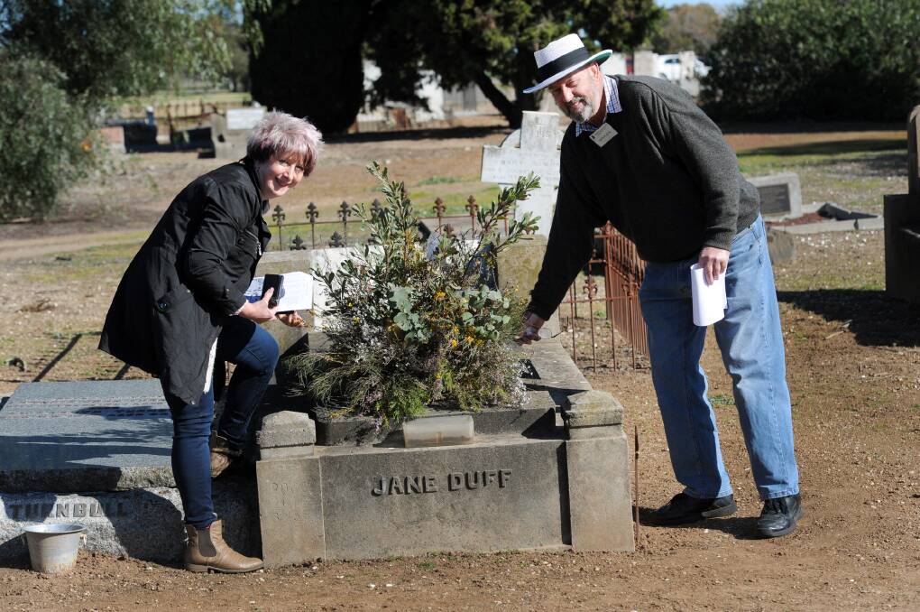 TOUR: Western Victorian Association of Historical Societies secretary Helen Curkpatrick and Wimmera Association of Genealogy president Ken Flack at the grave of Jane Cooper-Turnball, also known as Jane Duff, at Horsham cemetery, where a tour was hosted on Sunday. Picture: PAUL CARRACHER