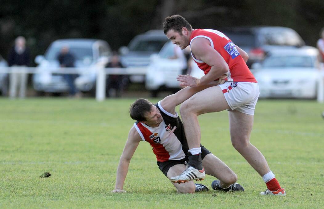 EFFORT: Edenhope-Apsley's Chris Oliver, pictured battling against Taylors Lake's Dylan Carroll, dominated across the half-back line at the weekend. Picture: SAMANTHA CAMARRI