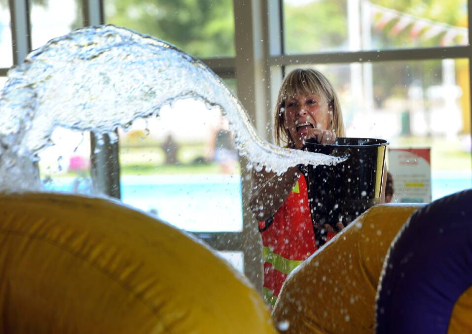 JANUARY: Mandy Kirsopp splashes water at the Horsham Aquatic Centre Australia Day pool party.