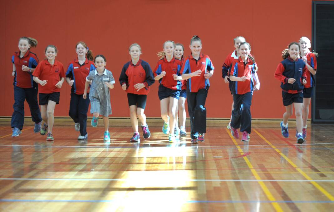 FUN RUN: Members of the Horsham Primary School 298 campus lunch-time running club jog through the school gym. Picture: ASHLEIGH MILLER