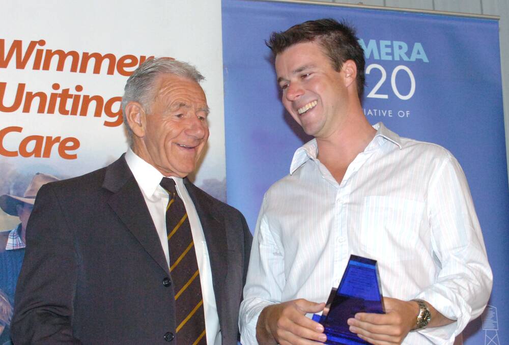 Tommy Hafey congratulates Mat Albrecht after winning a Wimmera 2020 Young Agri Business Achiever Award in 2006. Hafey was popular in the Wimmera, even spending his 80th birthday in the region at an event. Picture: JEFFREY CHAN