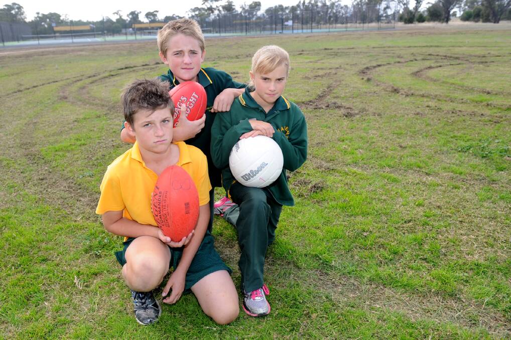 Haven students Codi Kenny, 10, Sam Cameron, 11, and Jerae Trigg, 11, are disappointed after hoons damaged the town's recreation reserve. Picture: SAMANTHA CAMARRI