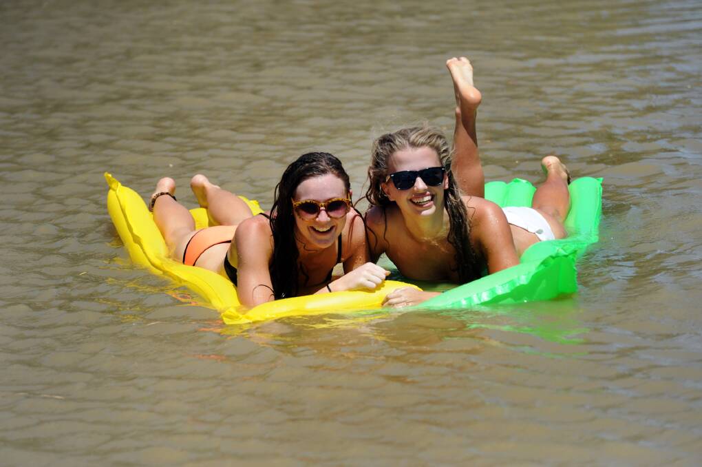 JANUARY: Laura Haase and Violet O'Donnell-Clancy enjoy a dip in the Wimmera River at Drummond Street, Horsham.