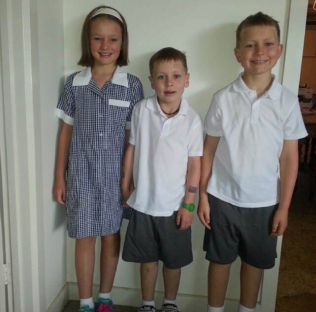 Siblings Emily, Tom and Will Hotker ready for grades four, prep and two respectively.