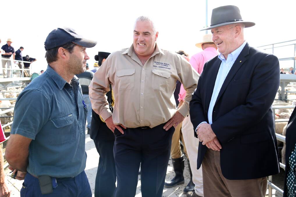 Farmer Russell Herd of South Wonwondah and Paul Christopher meet with Governor-General Peter Cosgrove at the Horsham Regional Livestock Exchange. Picture: THEA PETRASS