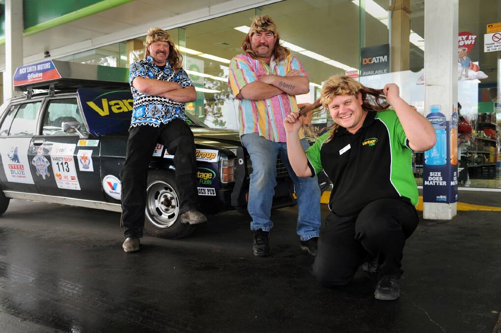 READY TO ROLL: Variety Bash entrants Rick Smith and Mick Harris with sponsor Nathan Werner at Horsham's BP Dimboola Road. Picture: PAUL CARRACHER