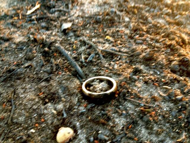 PRECIOUS: Mark Gaskin’s wedding ring in the ashes of the Grampians fire.