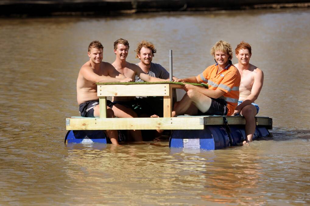 WHATEVER FLOATS YOUR BOAT: A group of Horsham friends created a floating picnic table after seeing a similar model on Facebook. Pictured, from left, are Ben Hobbs, Will Burgess, Tyler McRae, Liam Niewand and Alex Bryan. Picture: SAMANTHA CAMARRI