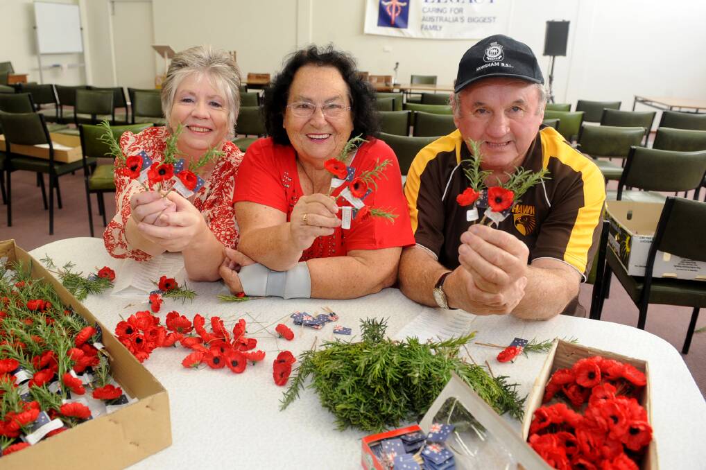 REMEMBER: The Wimmera’s Rosemary Remembrance Committee are making commemorative sprigs for Anzac Day. Pictured are committee secretary Lynne Wright, treasurer Alma Pitt and chairman John Byrne. Picture: SAMANTHA CAMARRI