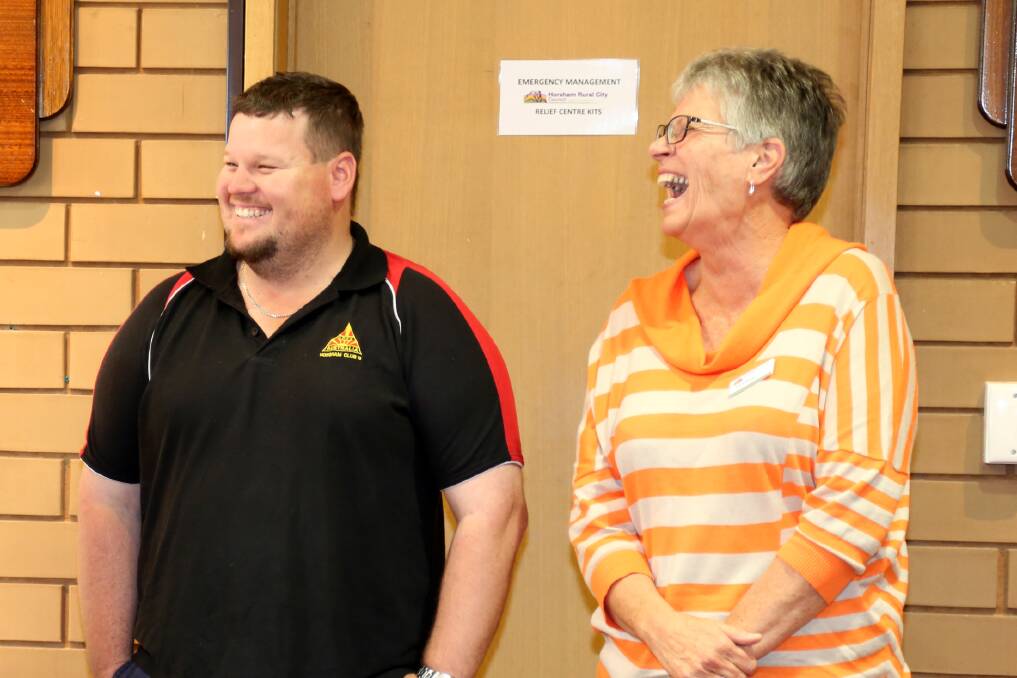 Apex's Ash Batchelor and Robin Barber share a laugh at a Grampians bushfire civic reception on Tuesday.