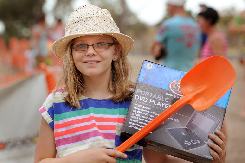PRIZE: Laura Daniel, 10, Horsham, with the prize she won during the diamond dig fundraiser.