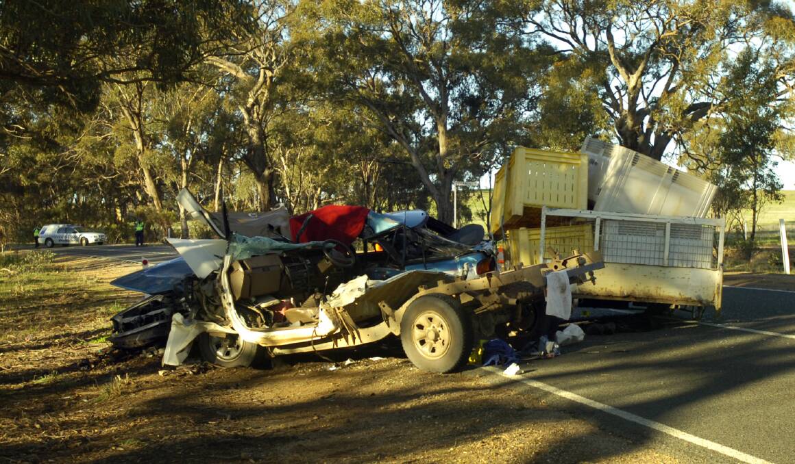 FATAL SCENE: Two cars block Stawell-Avoca Road at Concongella after Monday's head-on smash. Picture: TIM HESTER