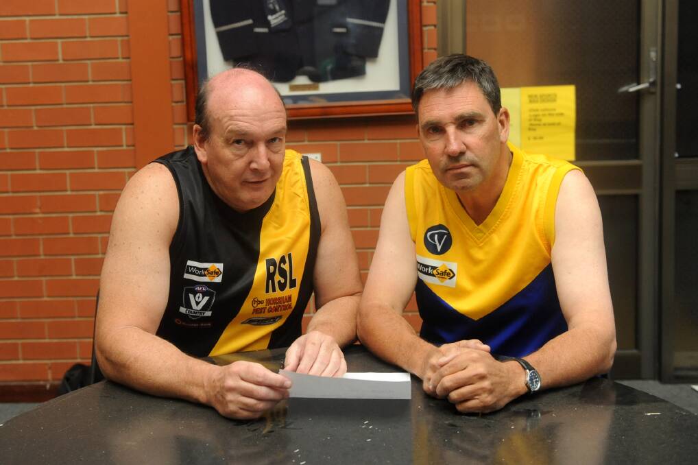 NATIMUK UNITED WE STAND: Horsham RSL Diggers president Peter Miller and Natimuk chairman Andrew Carine celebrate the clubs’ successful merger. Picture: SAMANTHA CAMARRI