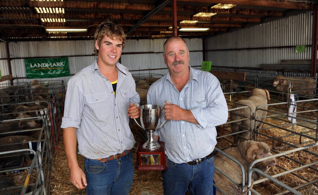TOP PRODUCER: The Royal Agriculture Society of Victoria has named Telangatuk East farmer Daniel Rogers Australian Young Sheep Breeder of the Year. Mr Rogers, left, is pictured with judge Kevin Beaton at the Balmoral Show last year, where he won the junior sheep judging competition. Picture: PAUL CARRACHER
