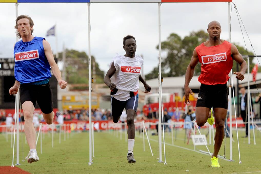 FUTURE SECURE: Andrew Boudrie, blue, wins heat 11 of the 2013 Stawell Gift. He beat Jamaica's Asafa Powell, who placed third. The Coalition and Labor Party both pledged $600,000 to keep the Stawell Gift in Stawell. Picture: SAMANTHA CAMARRI