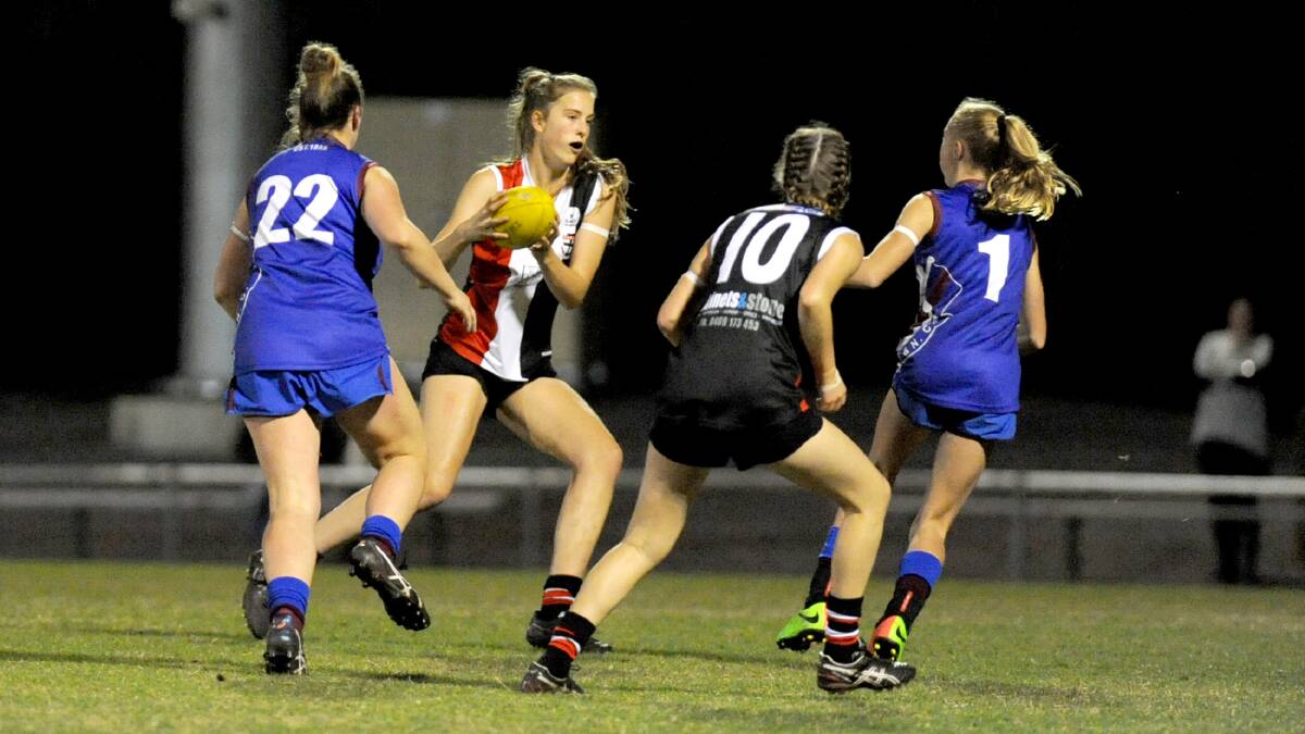 A big crowd watched the Horsham Saints and Horsham Demons youth girls teams face off under lights at Horsham City Oval in 2017.