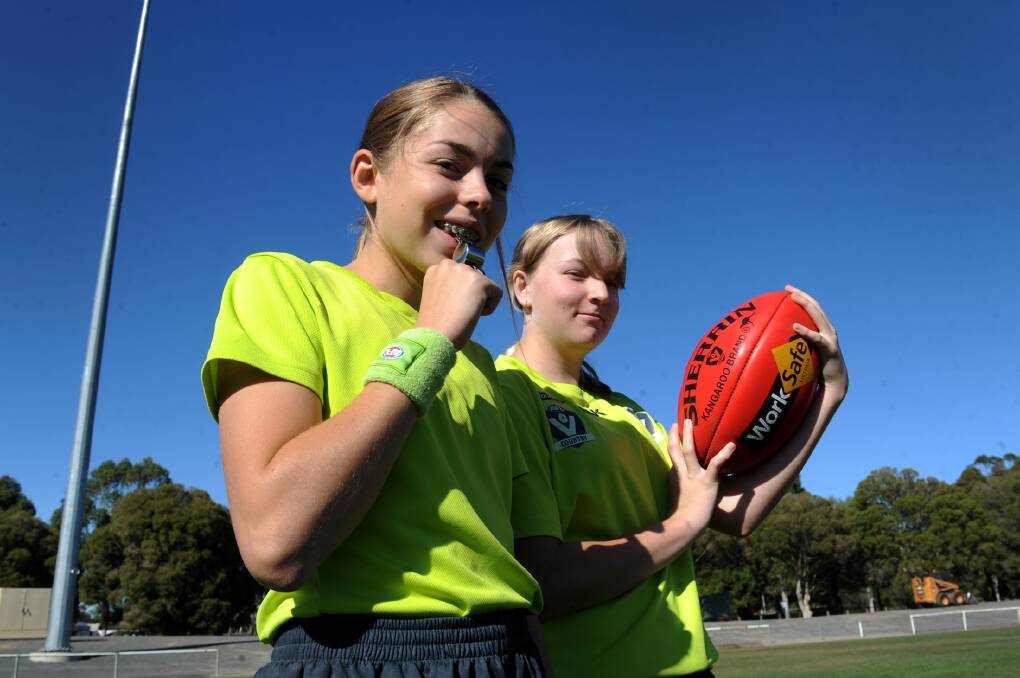 WHISTLE: Ella Walsgott, 13, and Paige Lane, 14, are two young female umpires keen to make their mark on football in the Wimmera. Picture: OLIVIA PAGE