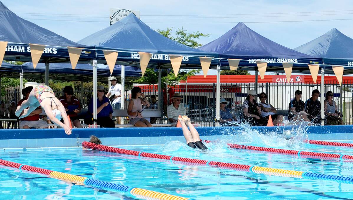 DIVE, DIVE, DIVE: Swimmers dive in during the 2016-17 district 12 swimming meet at Horsham Aquatic Centre on Saturday. Picture: OLIVIA PAGE