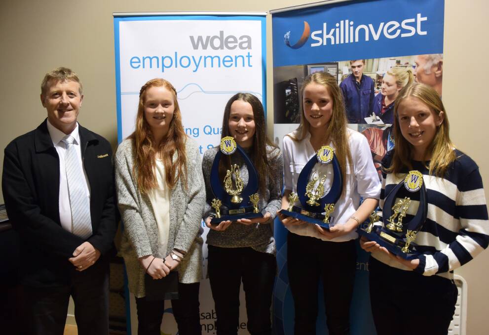 Rising star Georgia McIntyre, winner Madi Tayler, third-placed Emily Polack and runner-up Racquel Scott with the Skillinvest representative.