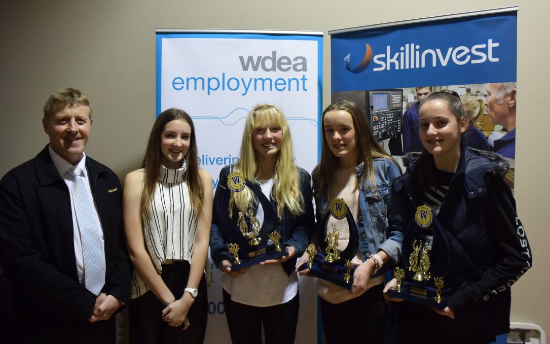 Rising star Sam Briggs, winner Madelyne Barber, third-placed Bridget Mcguckian and runner-up Eliza Camilleri with the Skillinvest representative. 